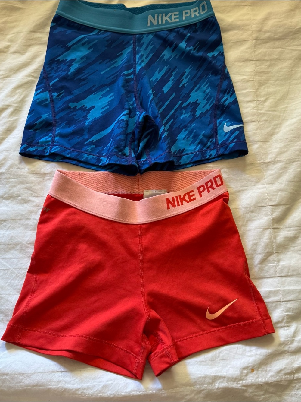 Women’s Nike Pro blue camouflage shorts and red shorts size s